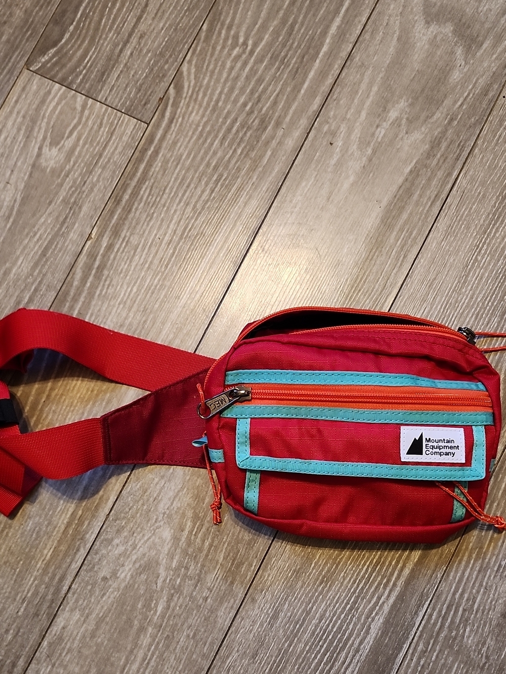 MEC Red Crossbody Waist Pack with Turquoise and Orange Trim